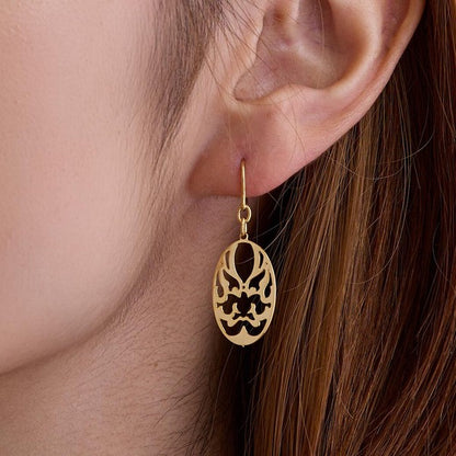 Model wearing Japanese paper-cut motif nickel-free earrings