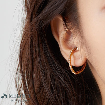 Pearl and crystal ear cuff on ear, UNIQKY
